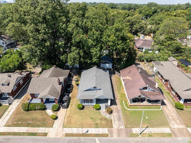 birds eye view of property with a forest view and a residential view