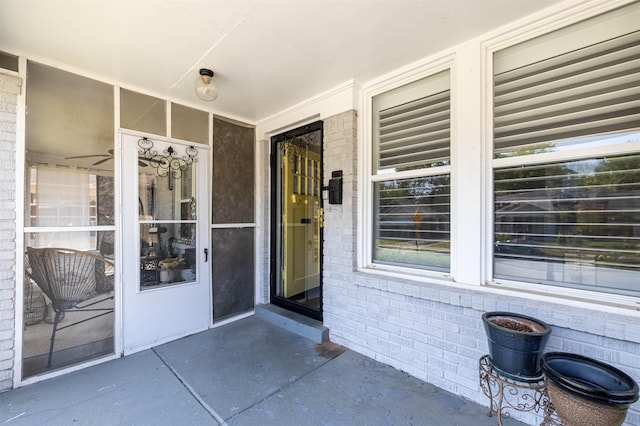 property entrance with brick siding