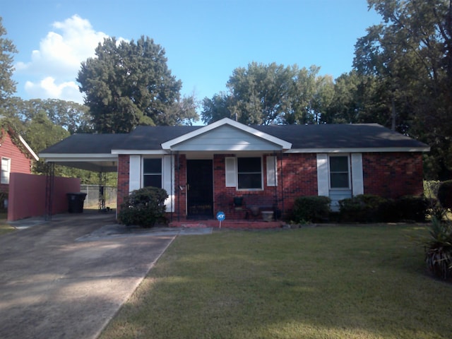 single story home with a front yard and a carport