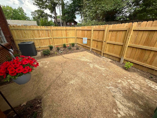 view of yard with a patio area and central AC