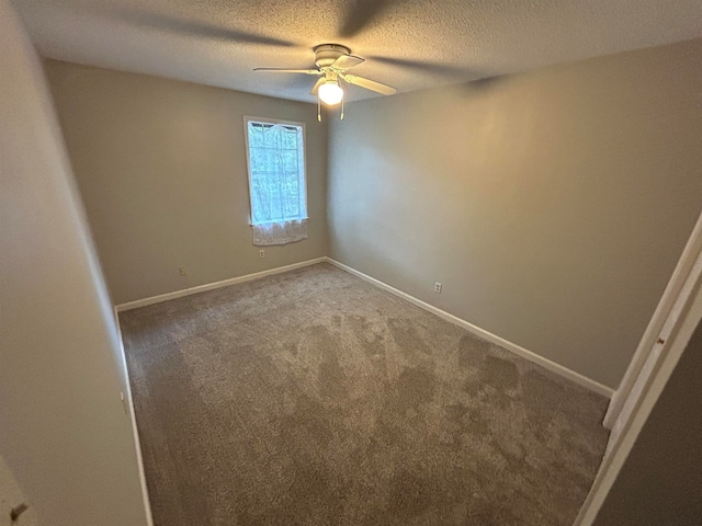 empty room featuring carpet flooring, ceiling fan, and a textured ceiling