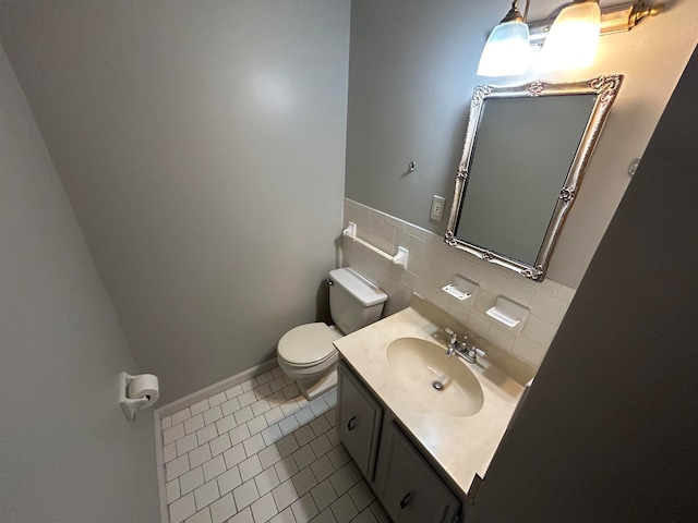 bathroom featuring vanity, backsplash, tile walls, toilet, and tile patterned floors