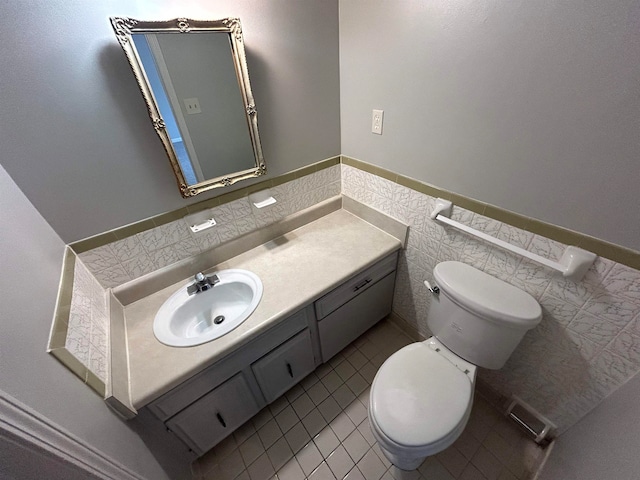 bathroom featuring vanity, toilet, and tile patterned floors