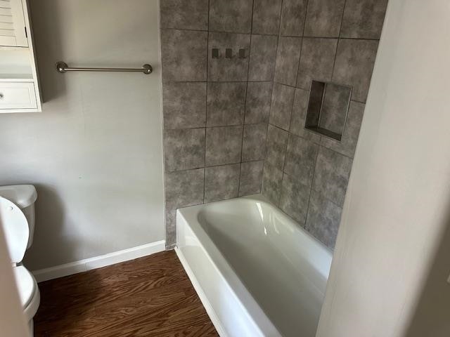 bathroom featuring hardwood / wood-style floors and toilet