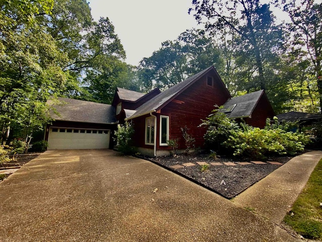 view of front of property with a garage and driveway