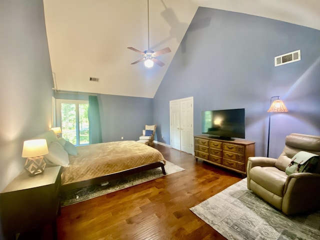 bedroom with high vaulted ceiling, visible vents, ceiling fan, and wood finished floors