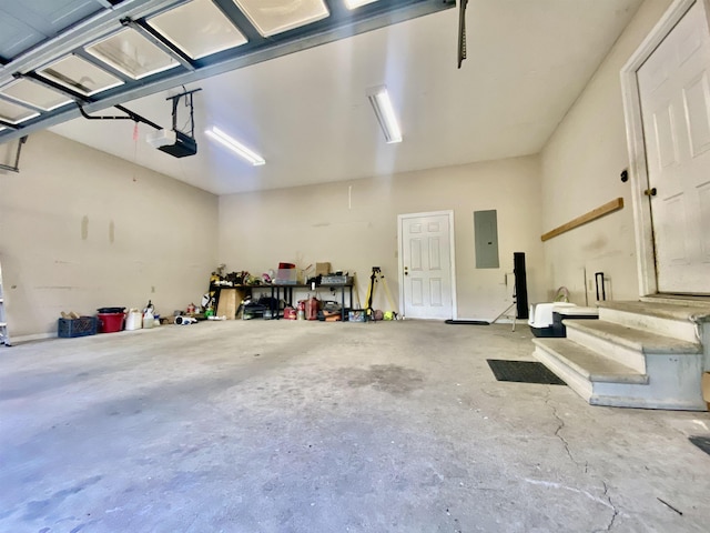 garage featuring a garage door opener and electric panel
