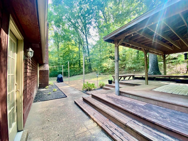 wooden terrace featuring a patio