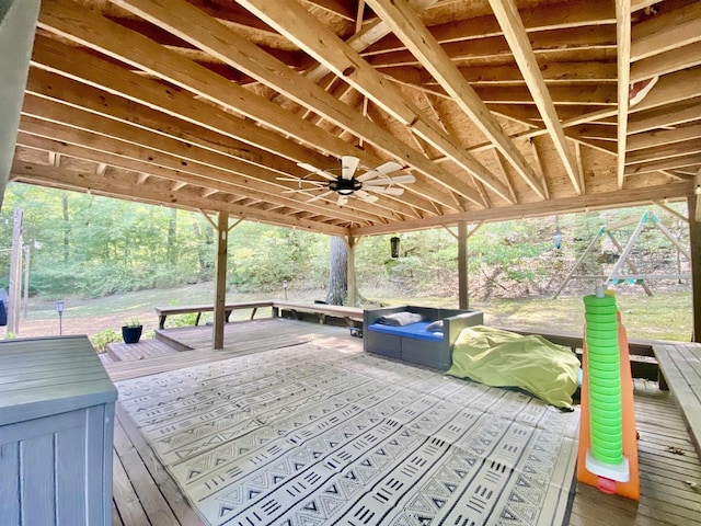 wooden terrace featuring a ceiling fan