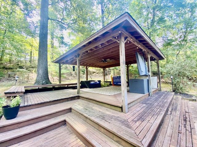 wooden deck featuring a ceiling fan