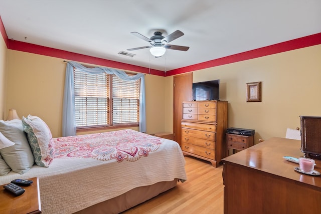 bedroom featuring light wood-type flooring and ceiling fan