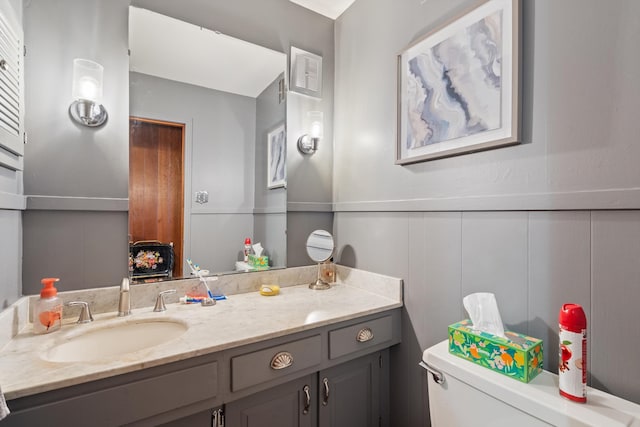 bathroom featuring toilet and vanity