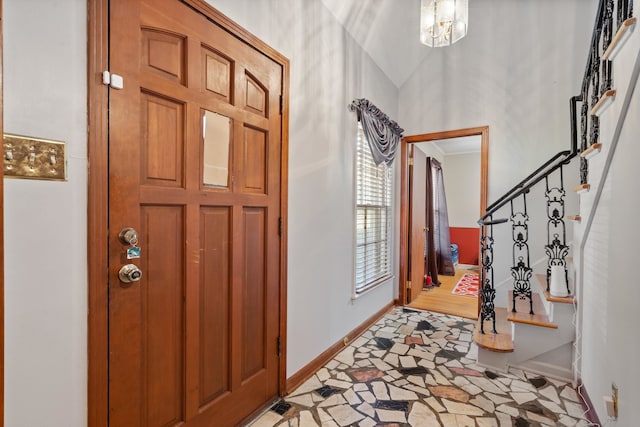 foyer with an inviting chandelier