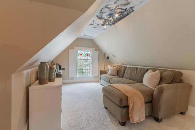 living room with lofted ceiling and light colored carpet