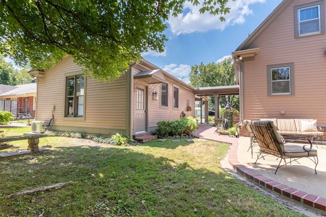 exterior space featuring ac unit, a patio, and a lawn