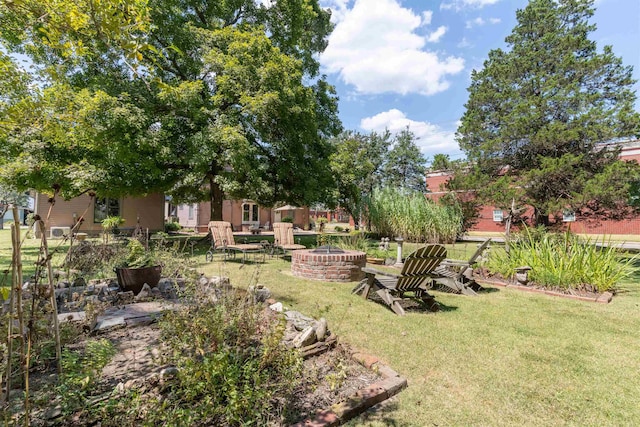 view of yard with a fire pit