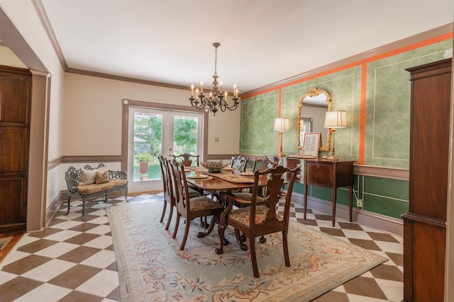 dining area featuring french doors, a notable chandelier, and ornamental molding