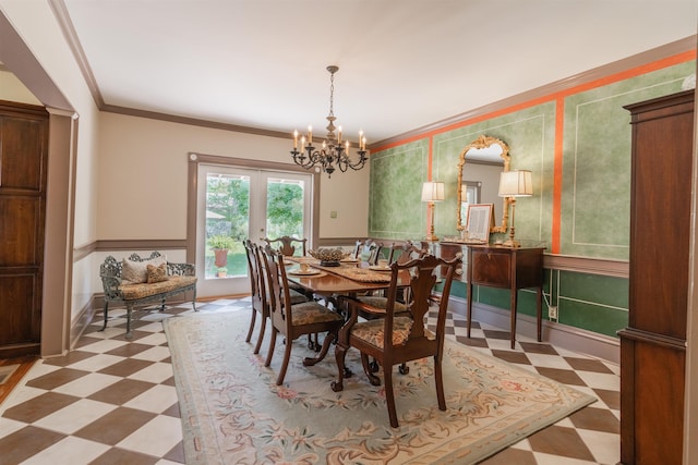 dining room with french doors, light floors, an inviting chandelier, and ornamental molding