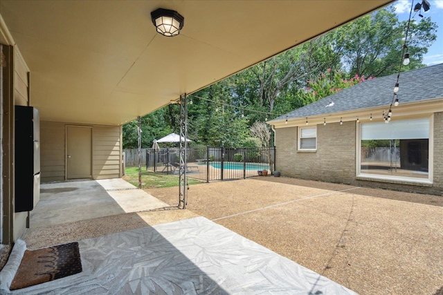 view of patio / terrace featuring a fenced in pool