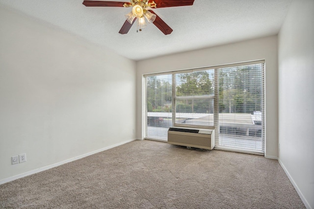 unfurnished room with ceiling fan, a textured ceiling, baseboards, and carpet floors