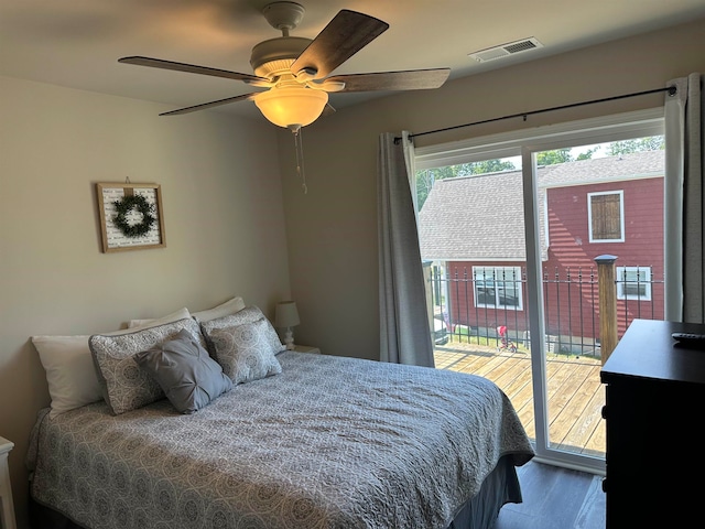 bedroom featuring hardwood / wood-style flooring, access to outside, and ceiling fan