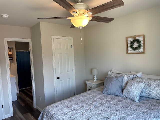 bedroom with dark wood-type flooring and ceiling fan