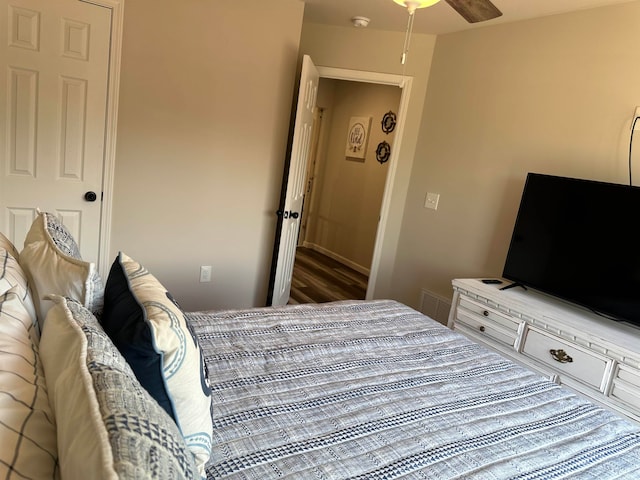 bedroom featuring wood-type flooring and ceiling fan