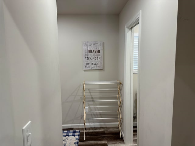 staircase with hardwood / wood-style flooring