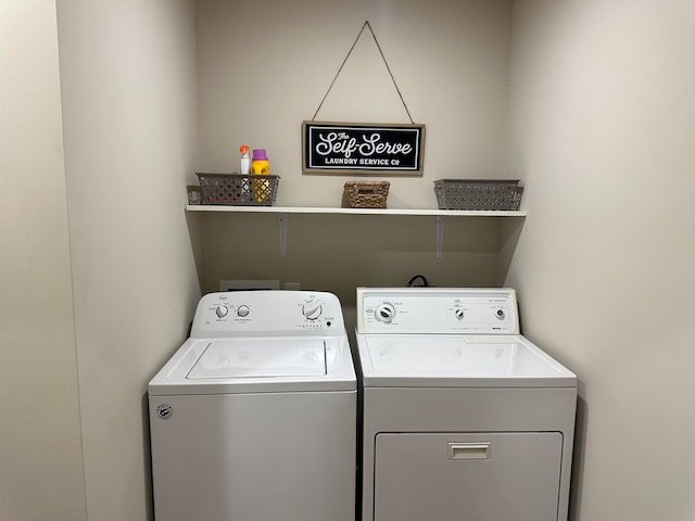 washroom featuring washing machine and dryer