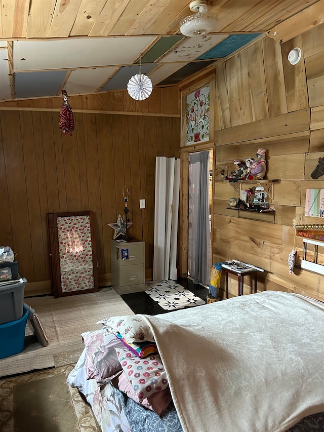 bedroom featuring wood ceiling and wooden walls