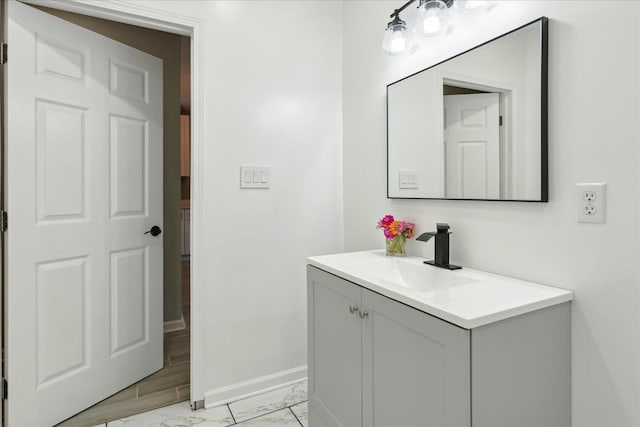 bathroom with hardwood / wood-style flooring and vanity