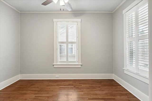 empty room featuring dark wood-type flooring, ceiling fan, and ornamental molding