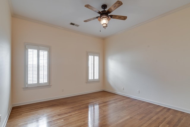 unfurnished room featuring crown molding, ceiling fan, and light wood-type flooring