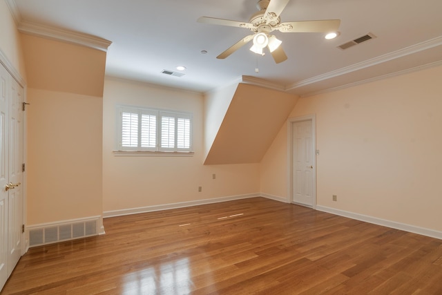 bonus room with light hardwood / wood-style flooring and ceiling fan