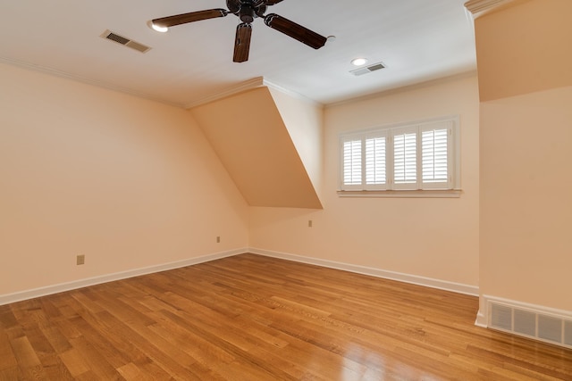 additional living space with ceiling fan and light hardwood / wood-style flooring