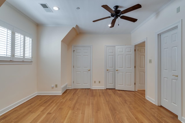 unfurnished bedroom featuring crown molding, ceiling fan, and light hardwood / wood-style floors