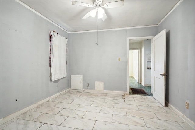 spare room featuring crown molding and ceiling fan