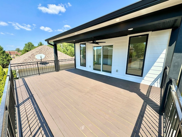 wooden deck featuring ceiling fan