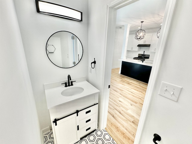 bathroom with vanity and hardwood / wood-style floors