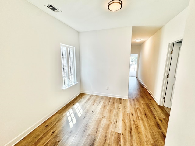 spare room with light hardwood / wood-style floors