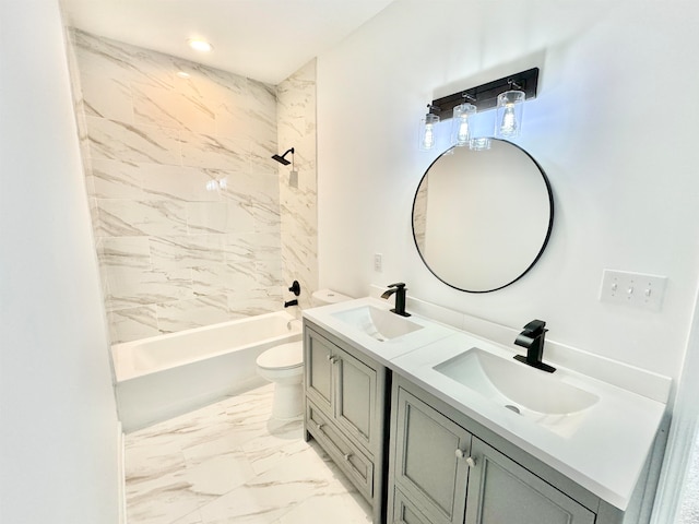 full bathroom featuring tiled shower / bath combo, vanity, and toilet