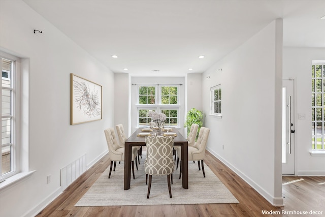 dining area with light hardwood / wood-style flooring