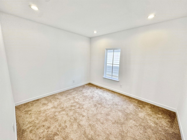 unfurnished room featuring carpet floors