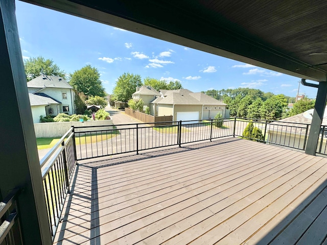 wooden terrace with a garage