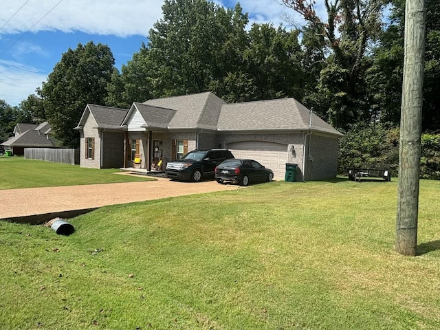 view of front facade with a garage and a front yard