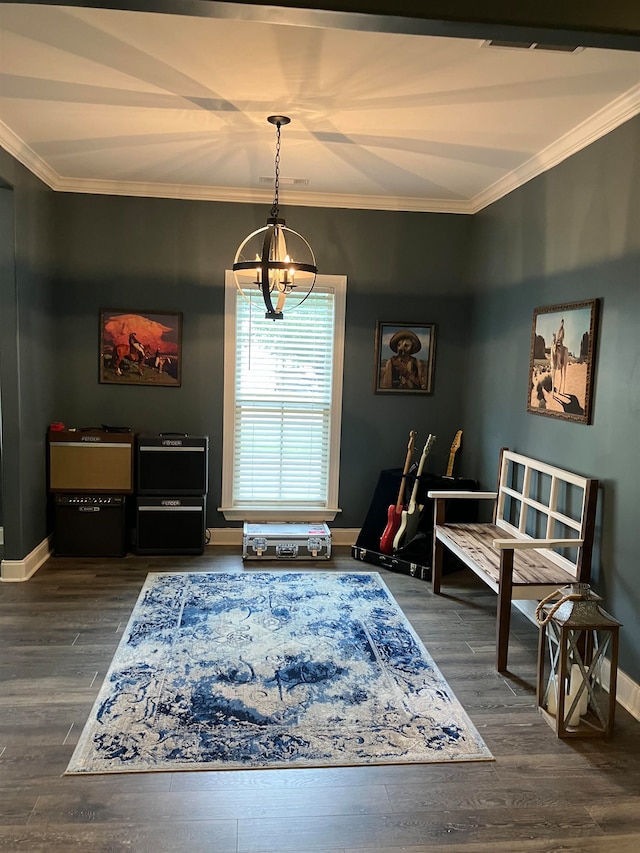 living area with an inviting chandelier, crown molding, and dark hardwood / wood-style flooring