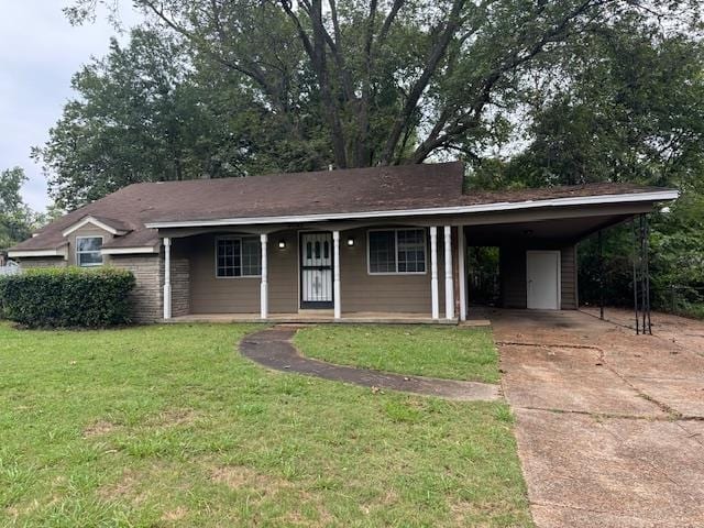 ranch-style house featuring a front yard and a carport