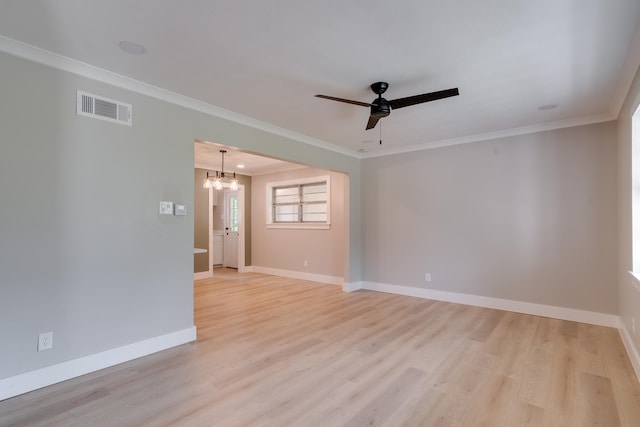 spare room with ceiling fan with notable chandelier, light wood-type flooring, and ornamental molding