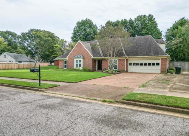 view of front of property with a garage and a front yard