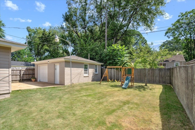 view of yard featuring a playground and an outbuilding